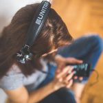 Teenage girl listening to headphones