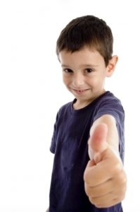 Boy showing thumbs up
