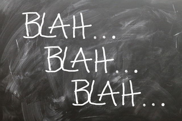 blackboard with words 'blah blah blah...'