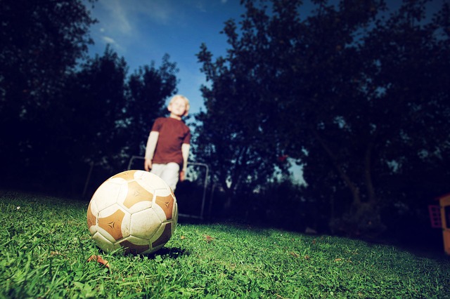 Child alone with football