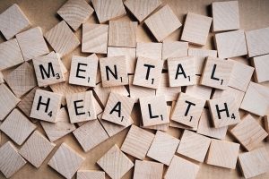 scrabble tiles spelling the words 'mental health'