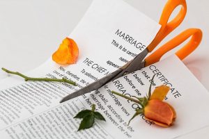 Wedding certificate being cut in half