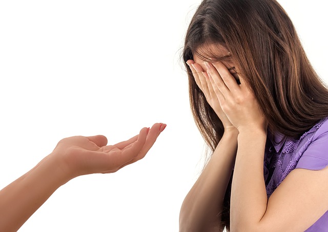 Crying Girl and Adult with helping hand