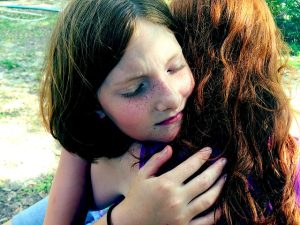 girls hugging - making up and solving problems