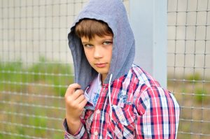 Boy with hood over his head