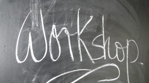 The word Workshop written in chalk on a blackboard