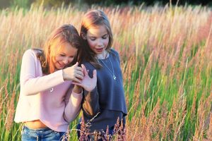 2 teen girls in a meadow