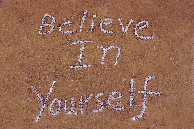 Shells in Sand spelling out'believe in yourself'