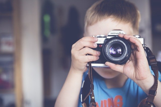 Boy focusing Camera