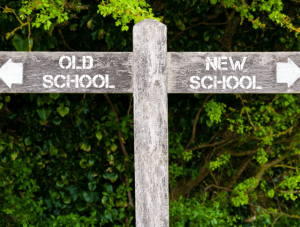 sign with arrows pointing to old school and new school