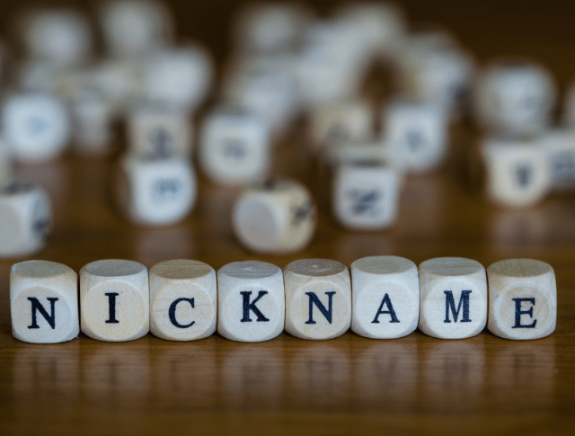 The word 'nickname' spelt out with wooden cubes