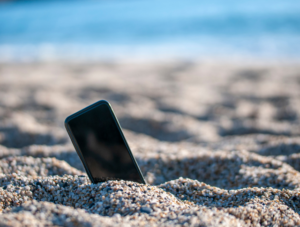 mobile phone in the sand on a beach