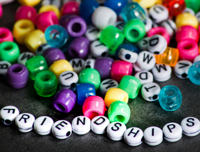 The word 'friendships' spelt out with jewellery beads