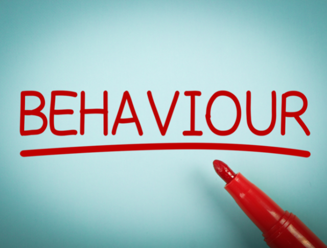The word 'Behaviour' written in red pen