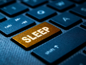The word 'sleep' written on a computer keyboard key