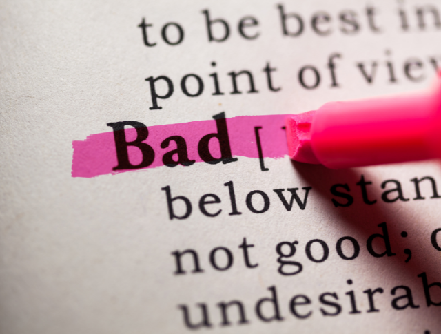 The word 'Bad' in the dictionary, highlighted with red pen.