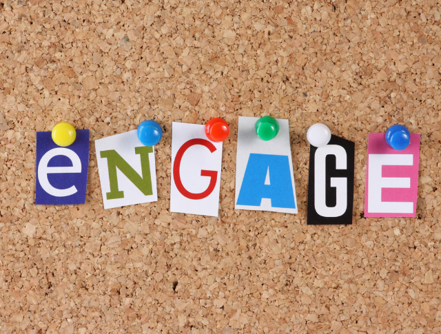The word 'engage' spelled out on a cork board