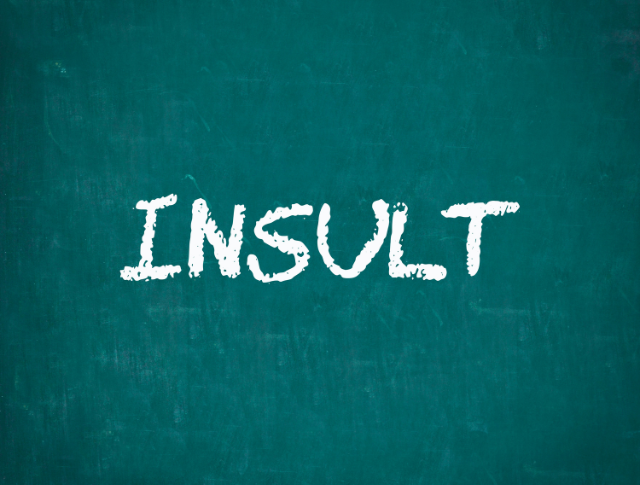 'Insult' written in white chalk on blackboard